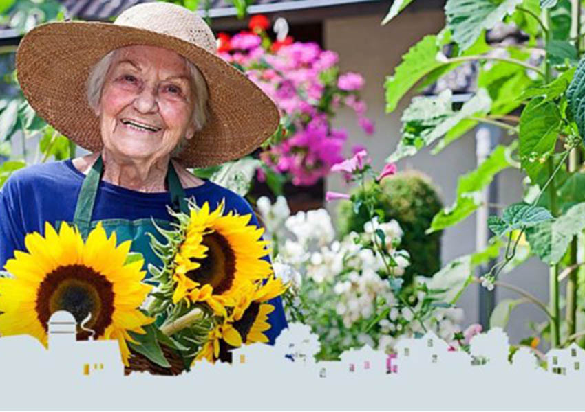 Senior woman smiling with sunflowers