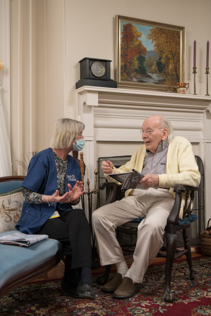 Caregiver speaking with resident