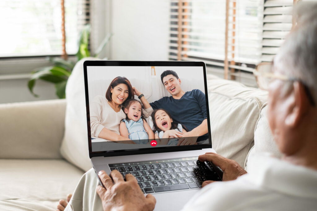 senior on a virtual call with family