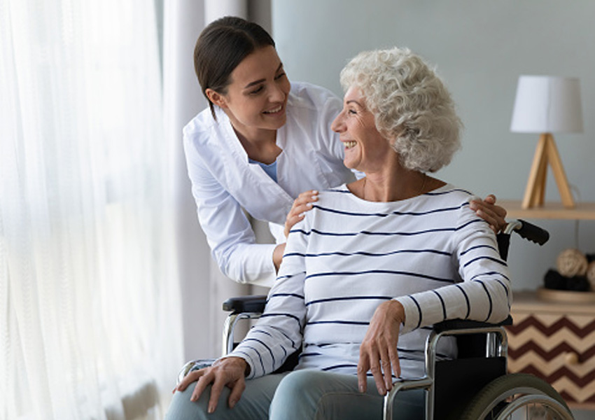 Caregiver talking with resident.