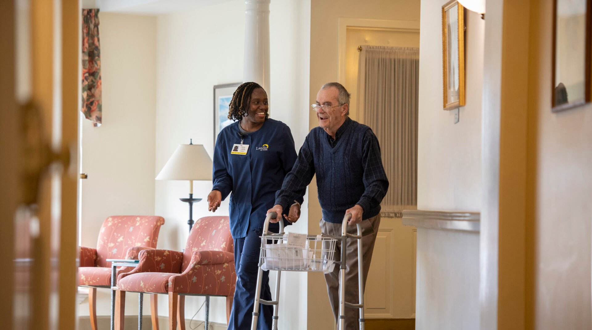 three seniors holding books and talking