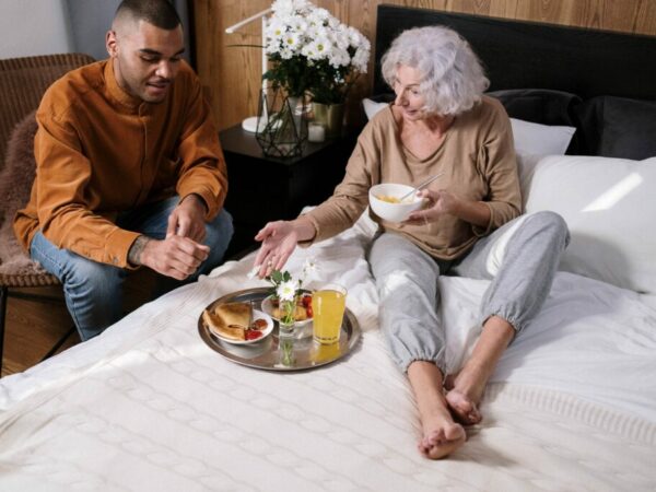 resident eating breakfast in bed