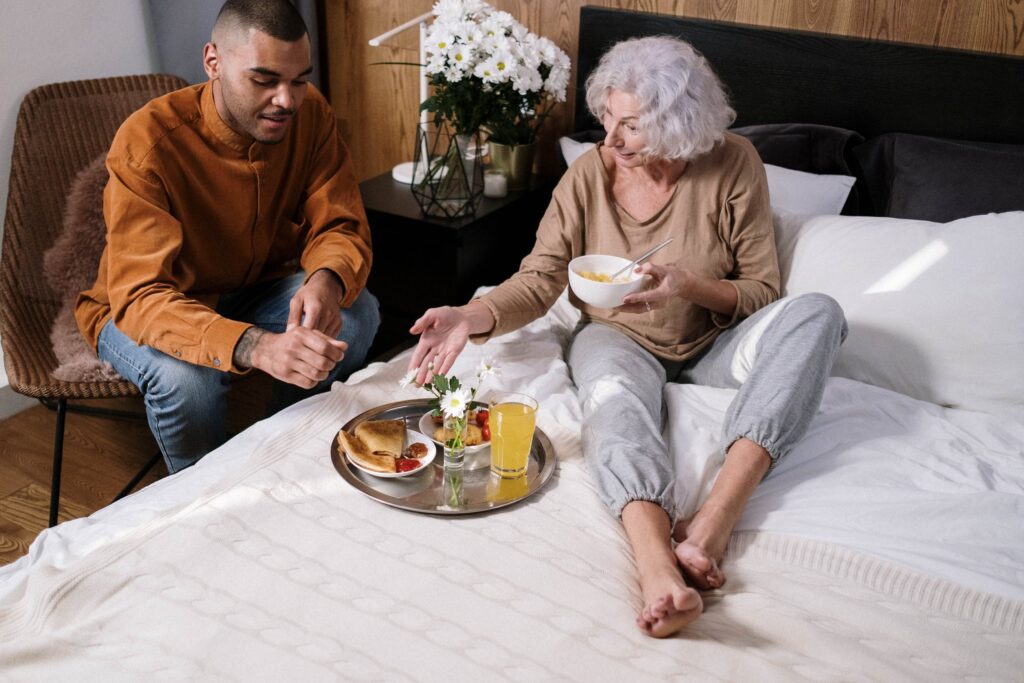 resident eating breakfast in bed